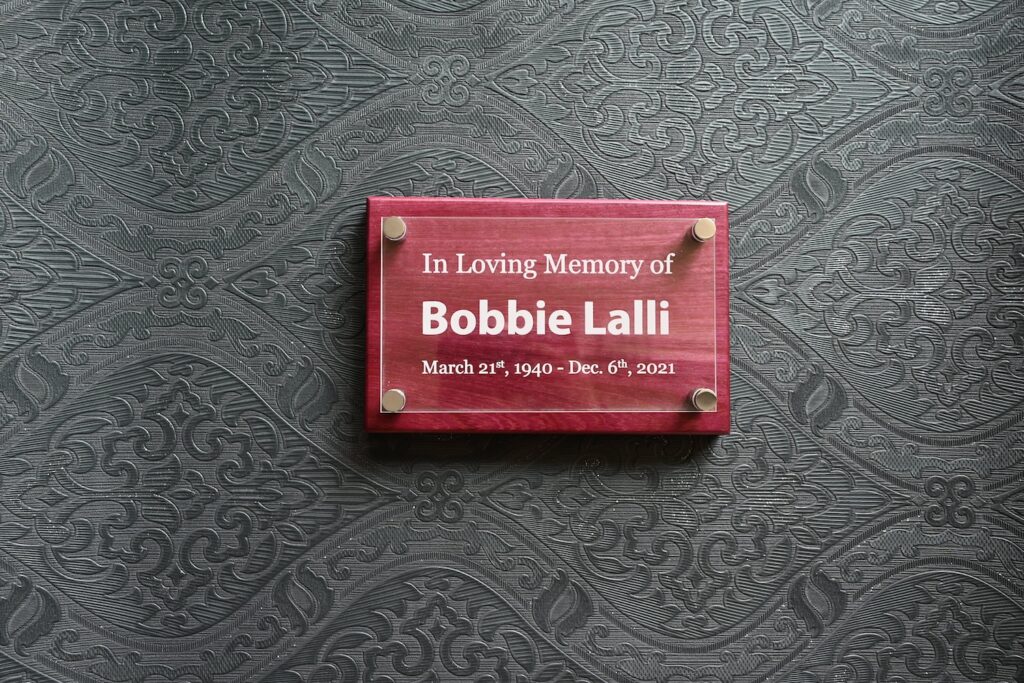 Acrylic engraving with standoffs on wood